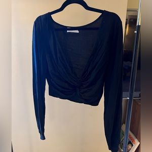 ❤️Urban Outfitters cropped top. Deep v-neck and twist tie at bottom.